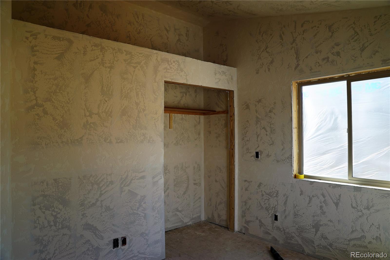 144 North Random Road Bailey, CO 80421 - Photo 7 of 9 a bathroom with a shower and a window