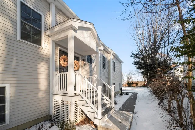 a view of a house with backyard and porch