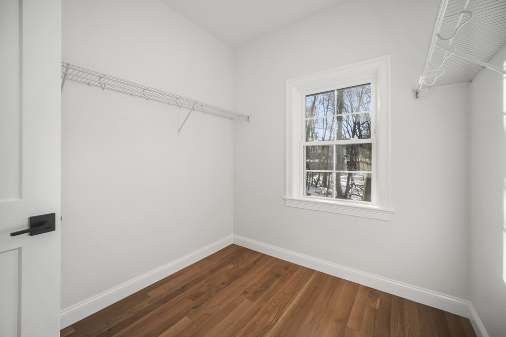 16 Clinton Street Marlborough, MA 01752 - Photo 21 of 39 a view of an empty room with wooden floor and a window