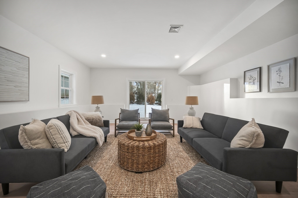16 Clinton Street Marlborough, MA 01752 - Photo 28 of 39 a living room with furniture and a couch