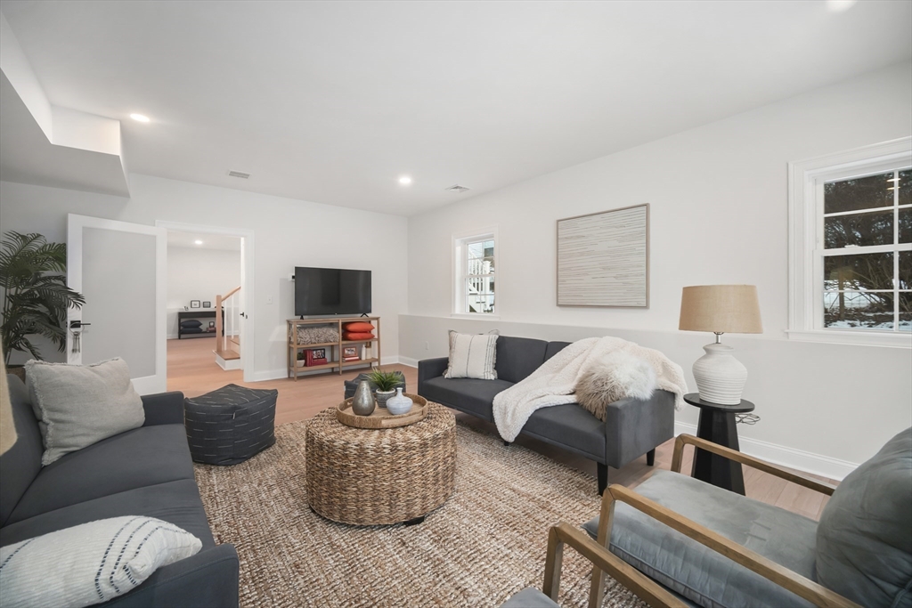 16 Clinton Street Marlborough, MA 01752 - Photo 30 of 39 a living room with furniture and a flat screen tv