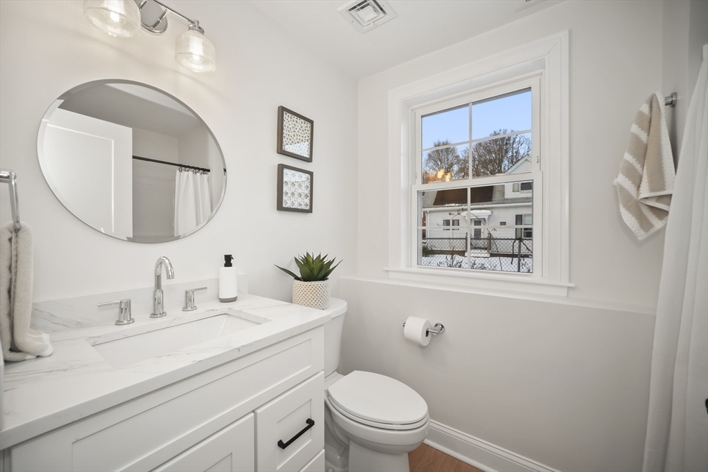 16 Clinton Street Marlborough, MA 01752 - Photo 31 of 39 a bathroom with a toilet a sink and mirror