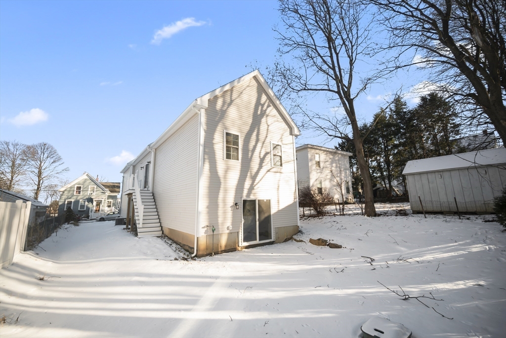 16 Clinton Street Marlborough, MA 01752 - Photo 37 of 39 a view of a house with a snow in the background