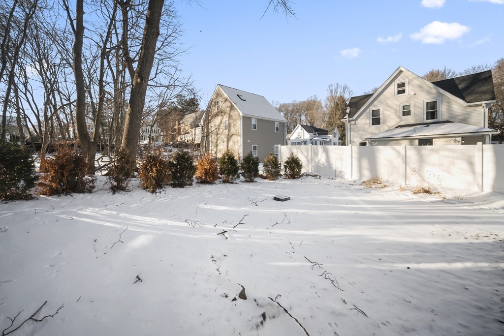 16 Clinton Street Marlborough, MA 01752 - Photo 38 of 39 a view of white house with a snow on the road
