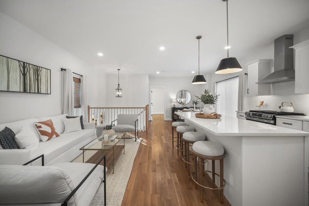 16 Clinton Street Marlborough, MA 01752 - Photo 6 of 39 a living room with furniture and a wooden floor