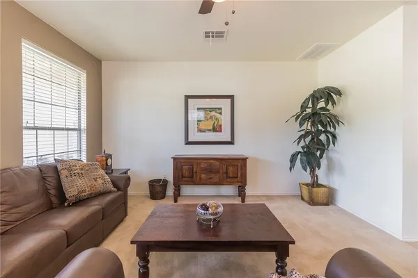 a living room with furniture and window