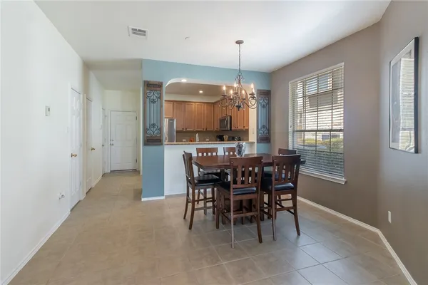 a dining room with furniture and window