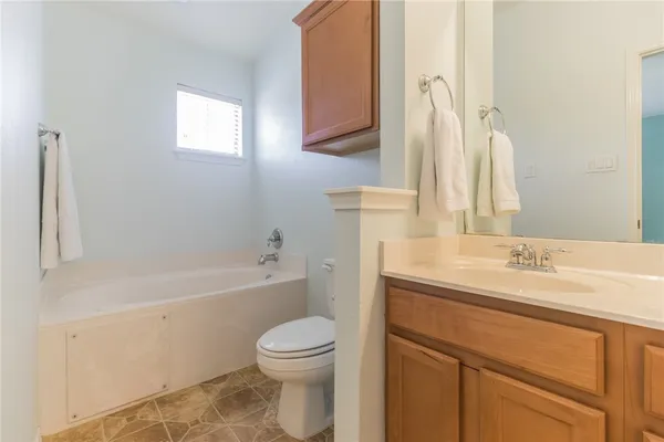 a bathroom with a sink a toilet and a bathtub