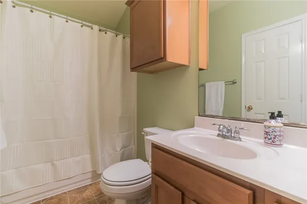 a bathroom with a sink toilet and vanity