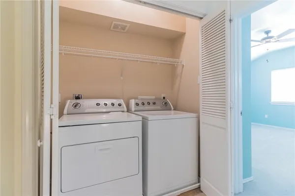 a utility room with dryer and washer