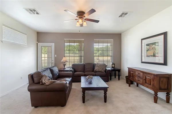 a living room with furniture and a window