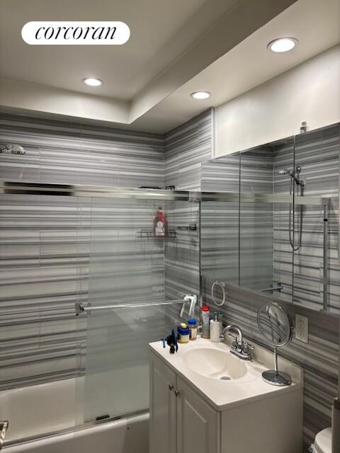 821 9th Avenue, Unit 2C Manhattan, NY 10019 - Photo 8 of 8 a bathroom with a sink and a mirror