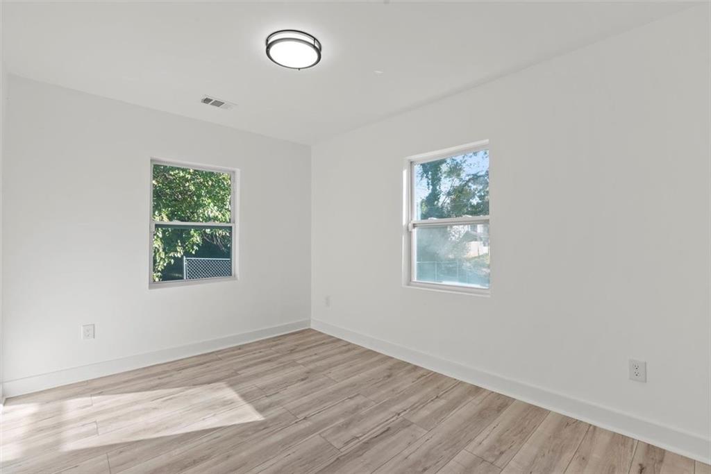5476 Old Rockbridge Road Stone Mountain, GA 30083 - Photo 16 of 35 an empty room with a window