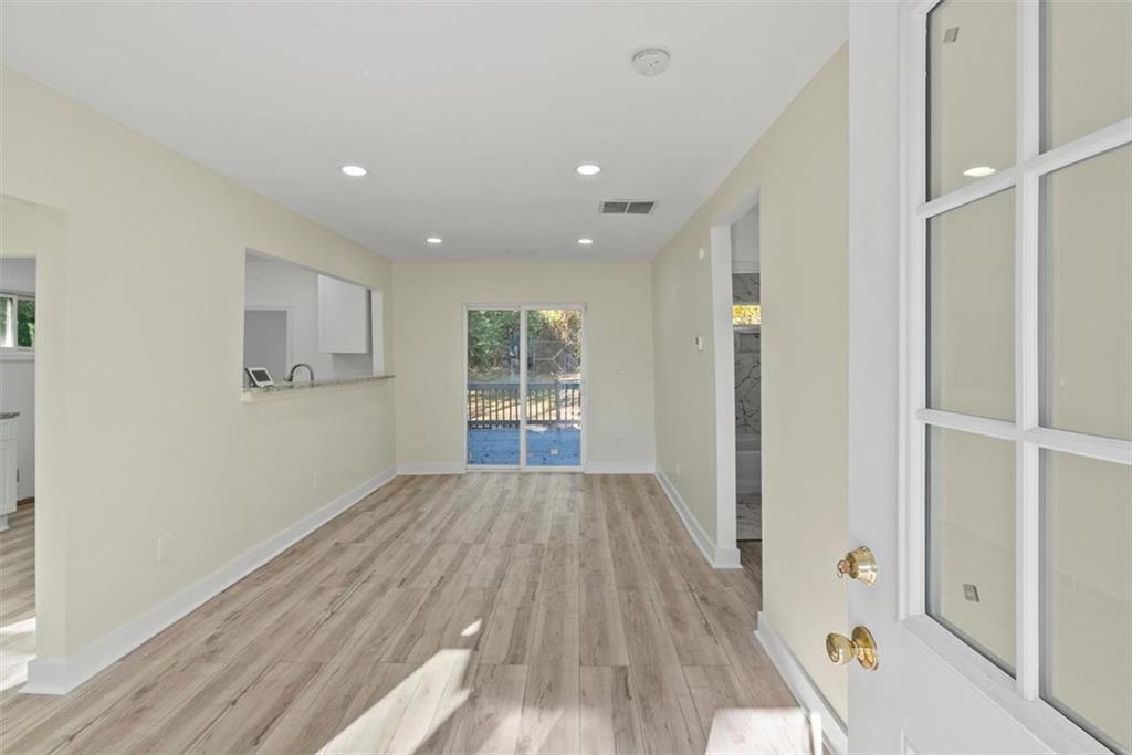 5476 Old Rockbridge Road Stone Mountain, GA 30083 - Photo 2 of 35 a view of hallway with wooden floor