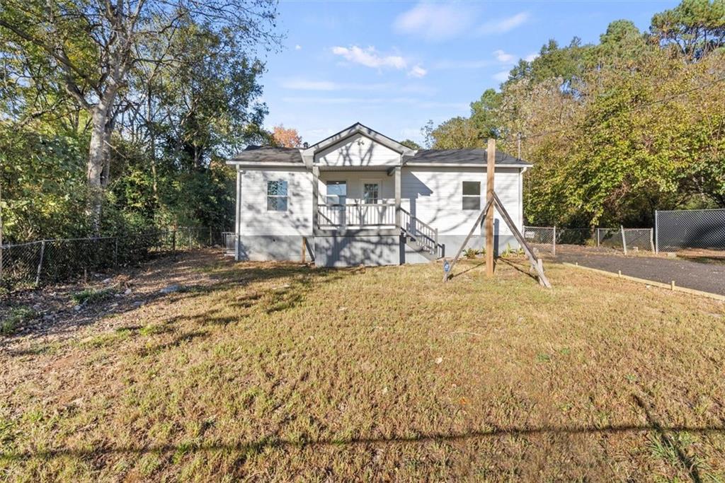 5476 Old Rockbridge Road Stone Mountain, GA 30083 - Photo 21 of 35 a view of a house with a yard