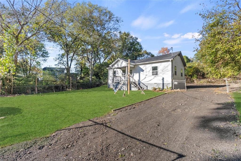 5476 Old Rockbridge Road Stone Mountain, GA 30083 - Photo 23 of 35 a view of a backyard with a garden and plants