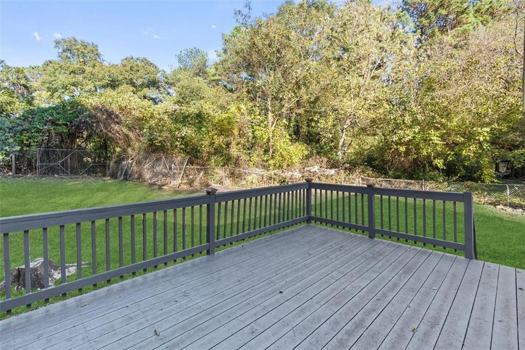 5476 Old Rockbridge Road Stone Mountain, GA 30083 - Photo 25 of 35 a view of a wooden deck