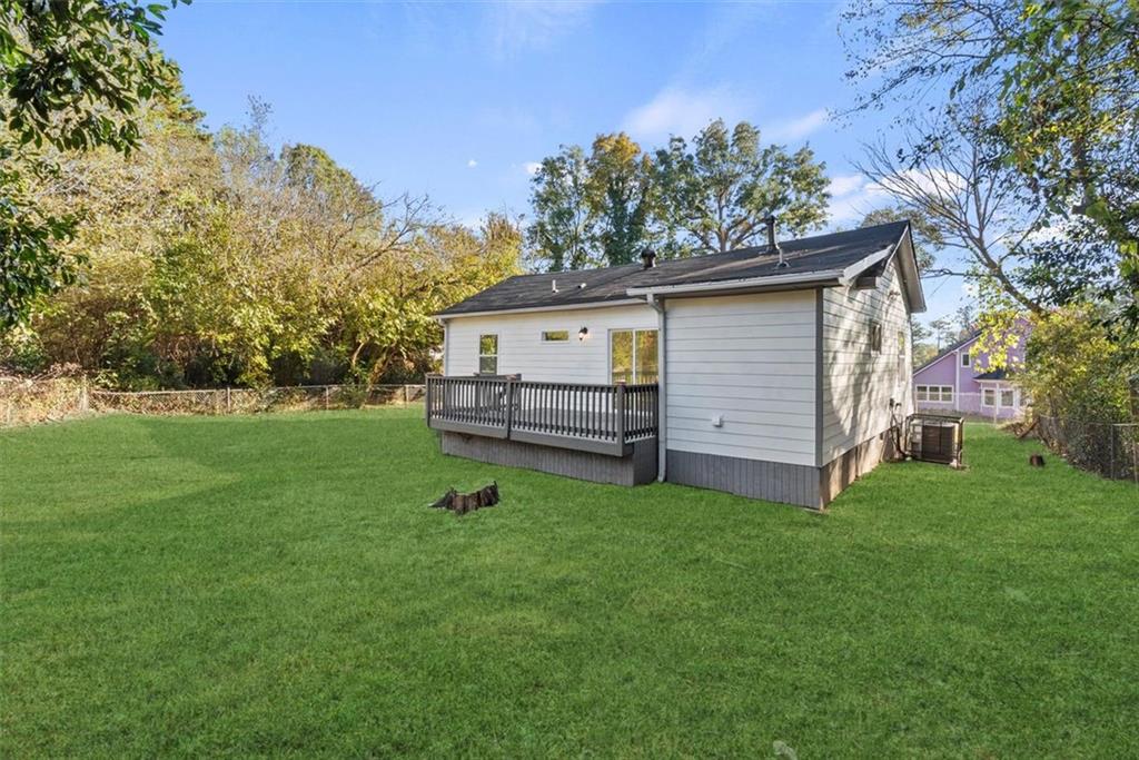 5476 Old Rockbridge Road Stone Mountain, GA 30083 - Photo 26 of 35 a view of backyard with a garden and entertaining space