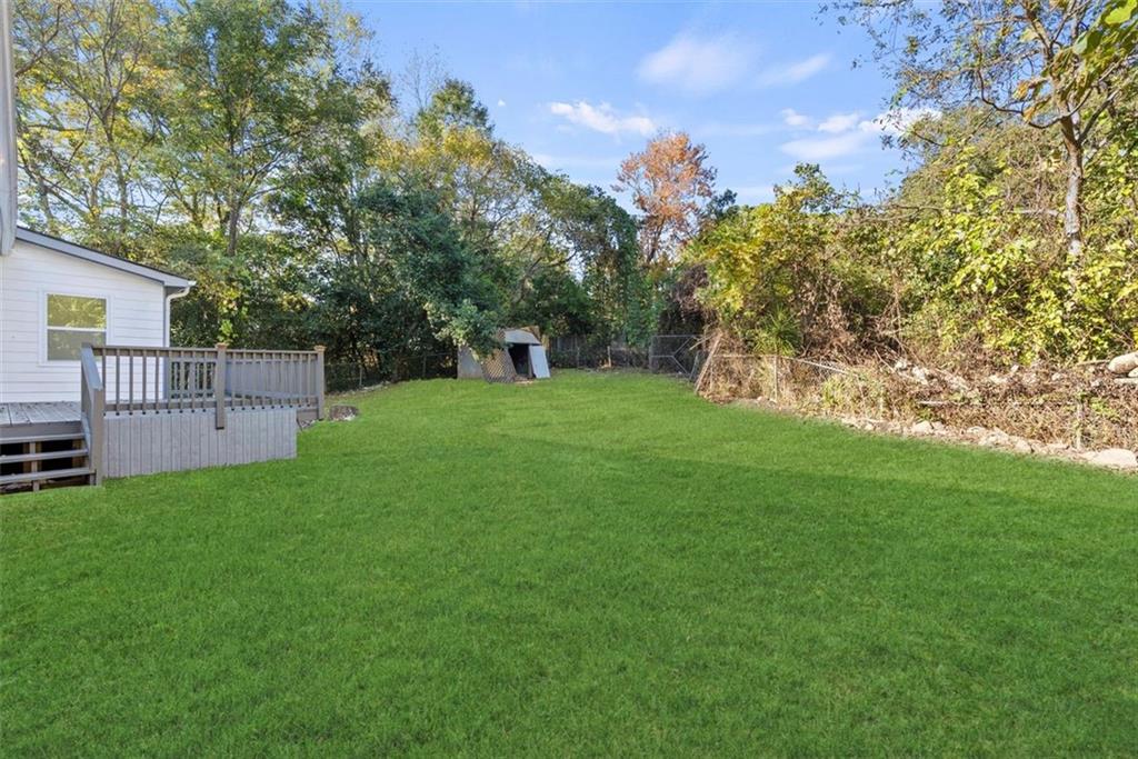 5476 Old Rockbridge Road Stone Mountain, GA 30083 - Photo 32 of 35 a view of a backyard with a garden