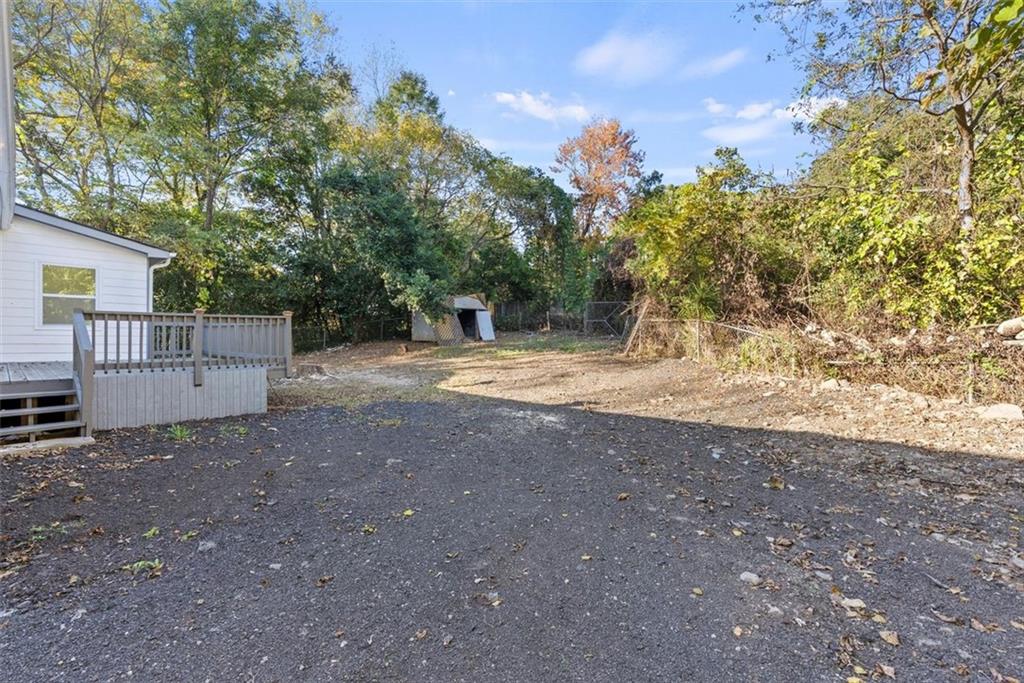 5476 Old Rockbridge Road Stone Mountain, GA 30083 - Photo 33 of 35 a view of backyard with green space