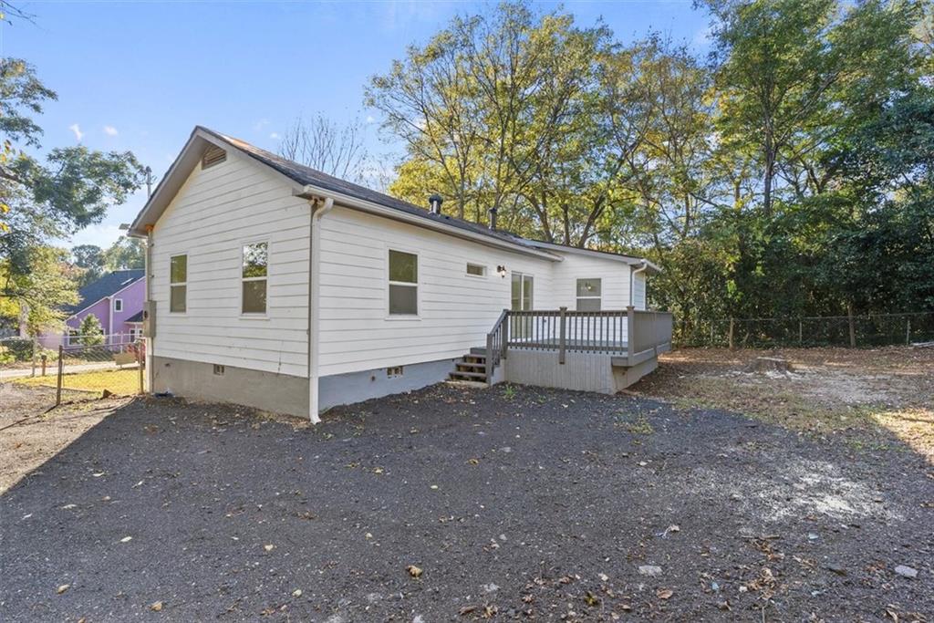 5476 Old Rockbridge Road Stone Mountain, GA 30083 - Photo 34 of 35 a view of a house with a backyard