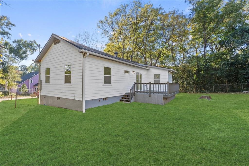 5476 Old Rockbridge Road Stone Mountain, GA 30083 - Photo 35 of 35 a view of a house with a backyard