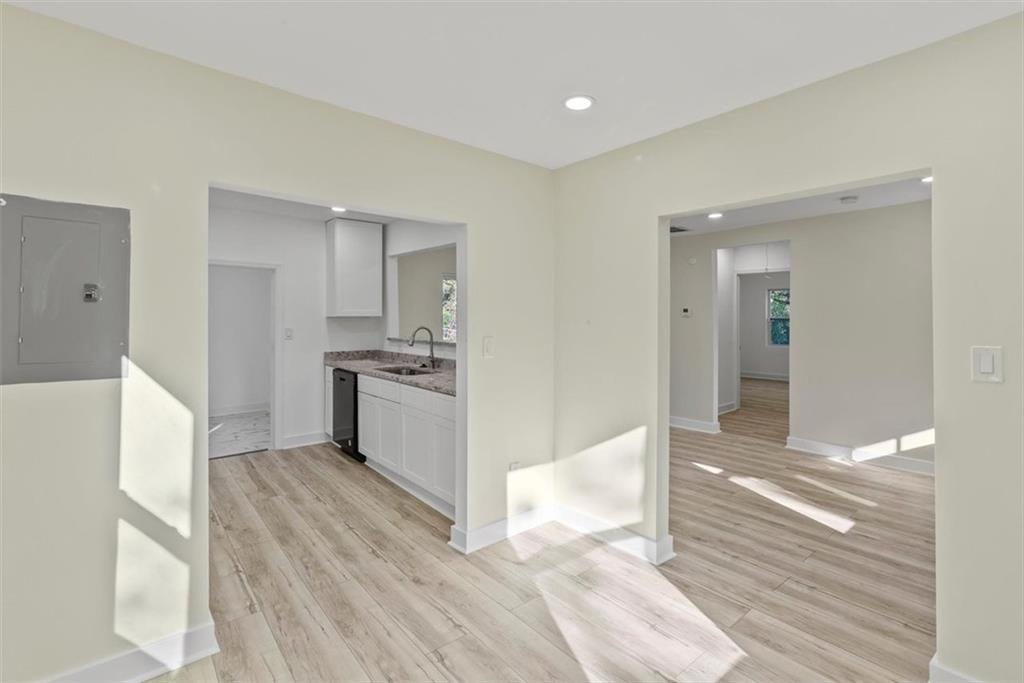 5476 Old Rockbridge Road Stone Mountain, GA 30083 - Photo 7 of 35 a view of kitchen with wooden floor