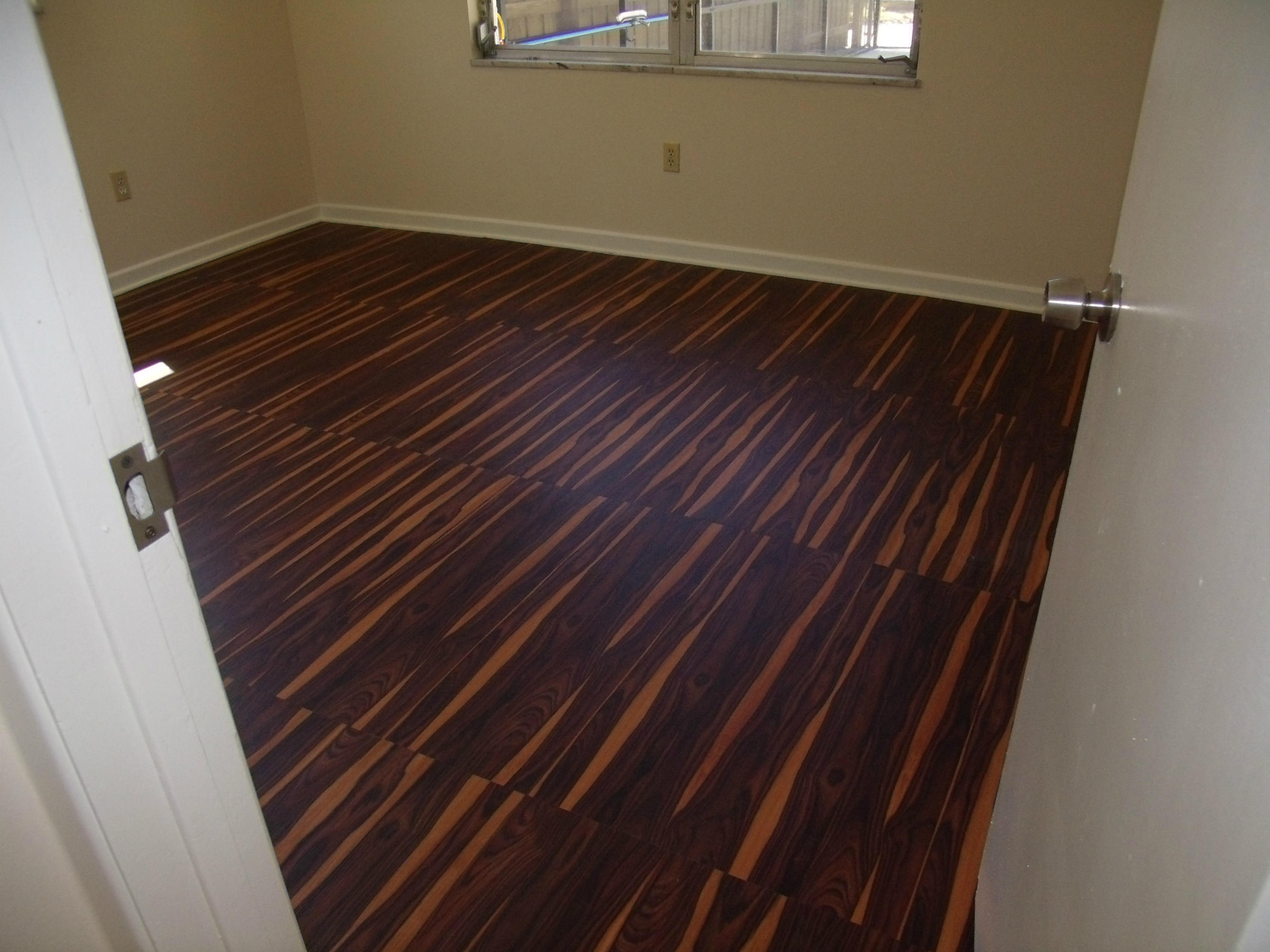 1909 Mayflower Road Fort Pierce, FL 34950 - Photo 13 of 43 Bedroom with custom flooring