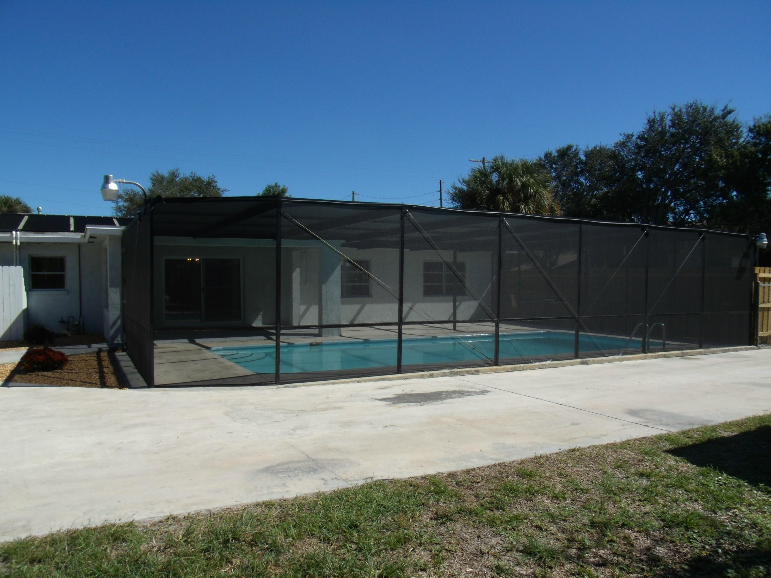 1909 Mayflower Road Fort Pierce, FL 34950 - Photo 28 of 43 Pool & Screened Enclosure