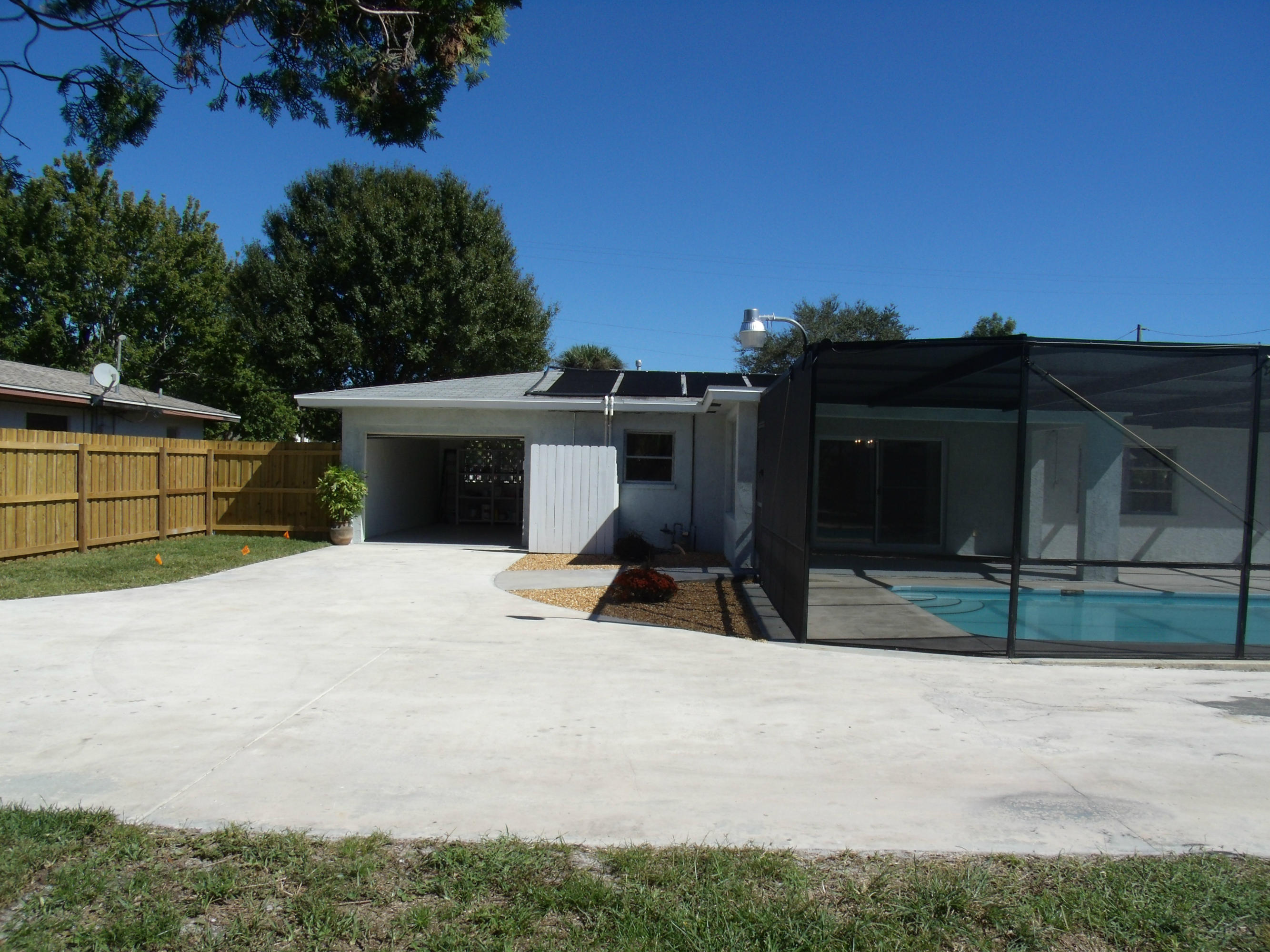 1909 Mayflower Road Fort Pierce, FL 34950 - Photo 29 of 43 Driveway & Garage entry