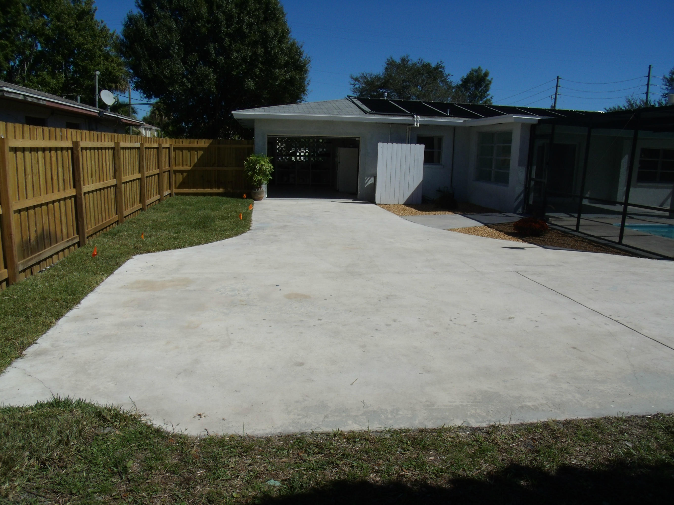 1909 Mayflower Road Fort Pierce, FL 34950 - Photo 35 of 43 Extra Long Fence Back Paved Driveway