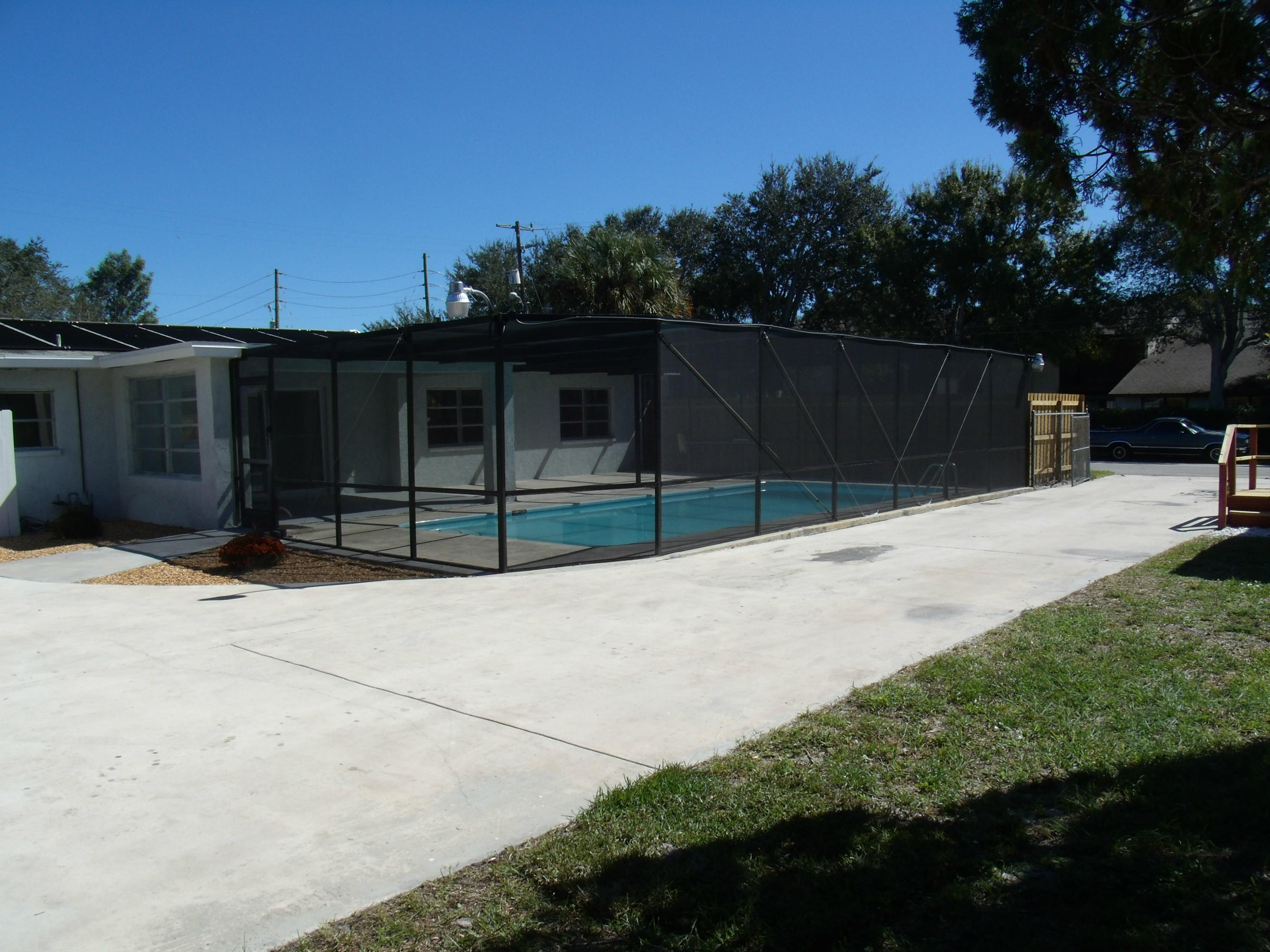 1909 Mayflower Road Fort Pierce, FL 34950 - Photo 36 of 43 Pool & driveway