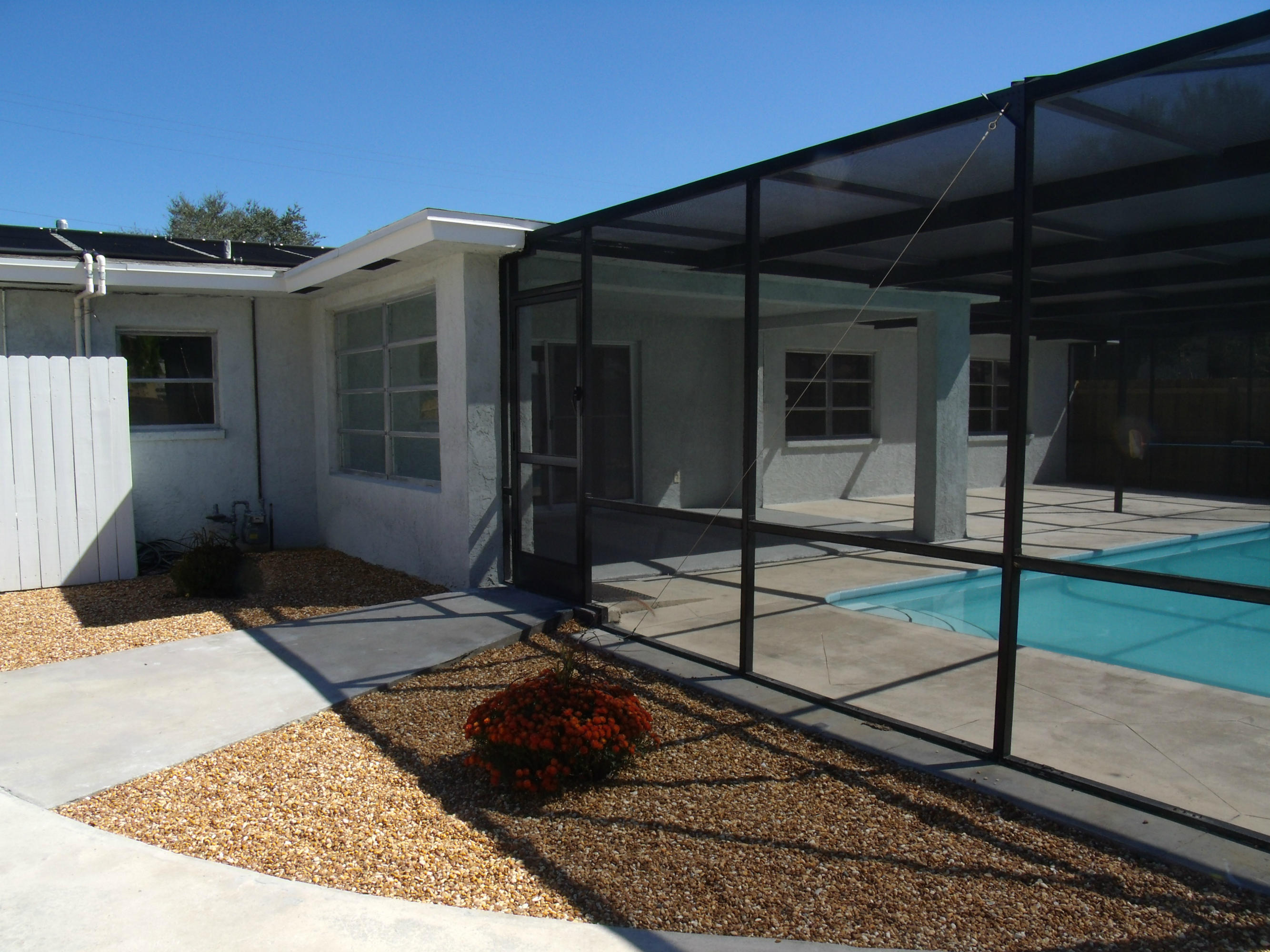 1909 Mayflower Road Fort Pierce, FL 34950 - Photo 38 of 43 walkway to pool