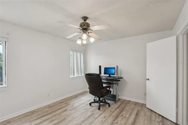 a workspace with furniture and a window