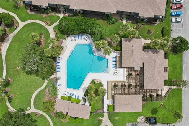 an aerial view of a house with a lake view