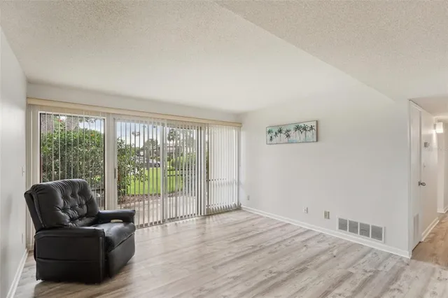 a view of livingroom with furniture and floor to ceiling window