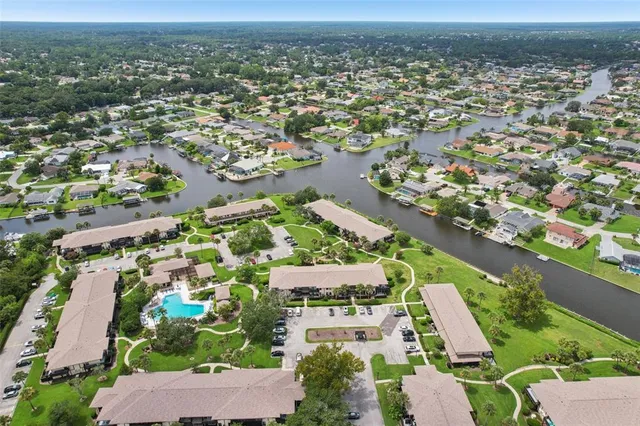an aerial view of residential houses with outdoor space