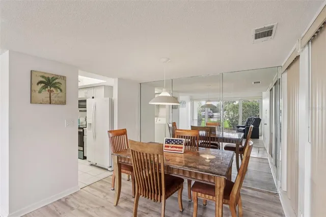 a view of a dining room with furniture window and outside view