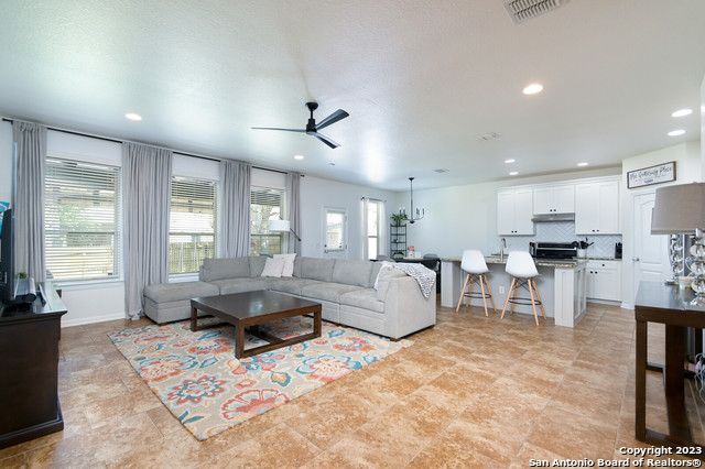 5160 Timber Springs Schertz, TX 78108 - Photo 1 of 1 a living room with furniture kitchen view and a large window