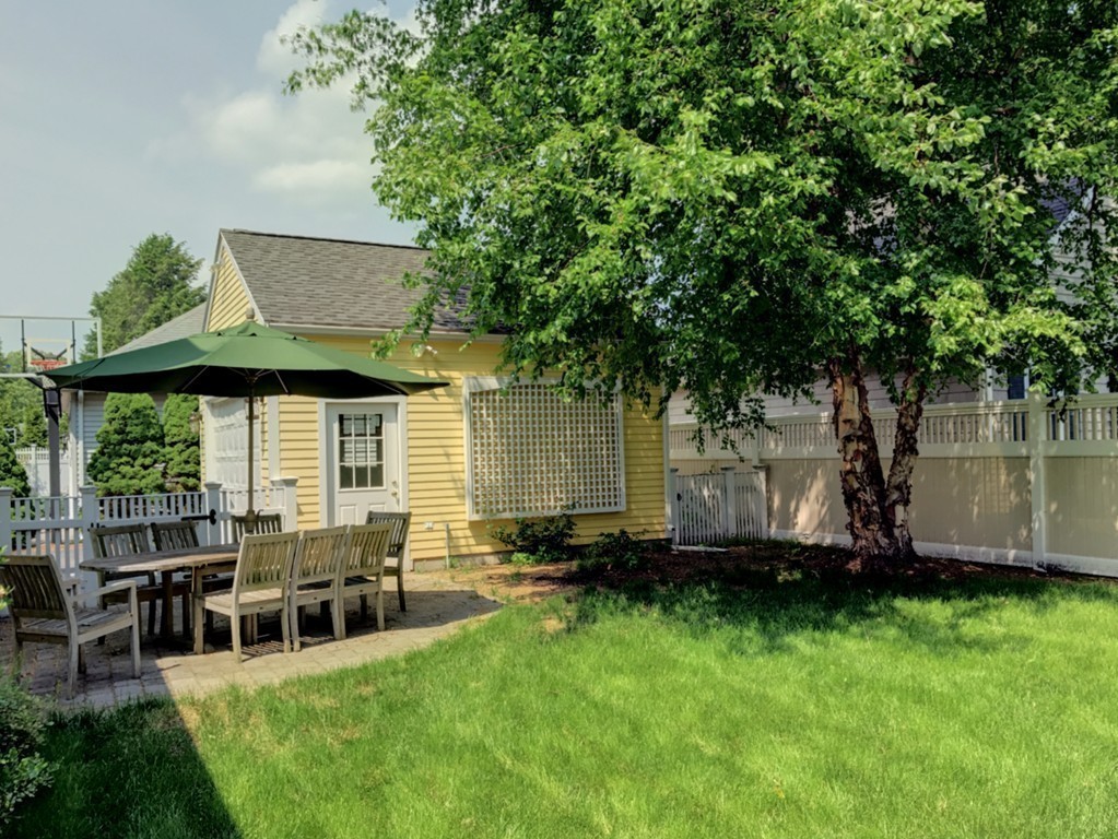 44 Stevens Road Needham, MA 02492 - Photo 11 of 14 a view of a chair and table in backyard of the house