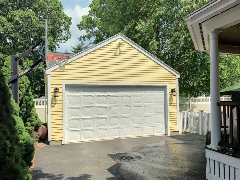 44 Stevens Road Needham, MA 02492 - Photo 13 of 14 a view of a house with a yard and garage