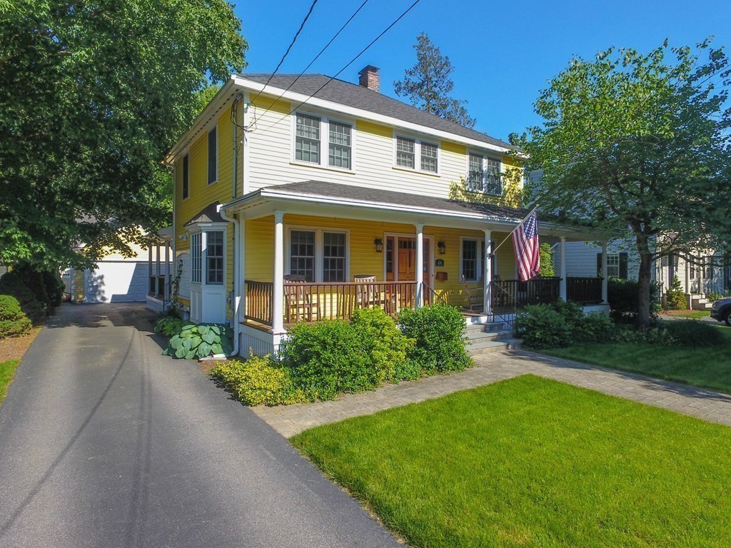 44 Stevens Road Needham, MA 02492 - Photo 10 of 14 a front view of a house with a yard and potted plants