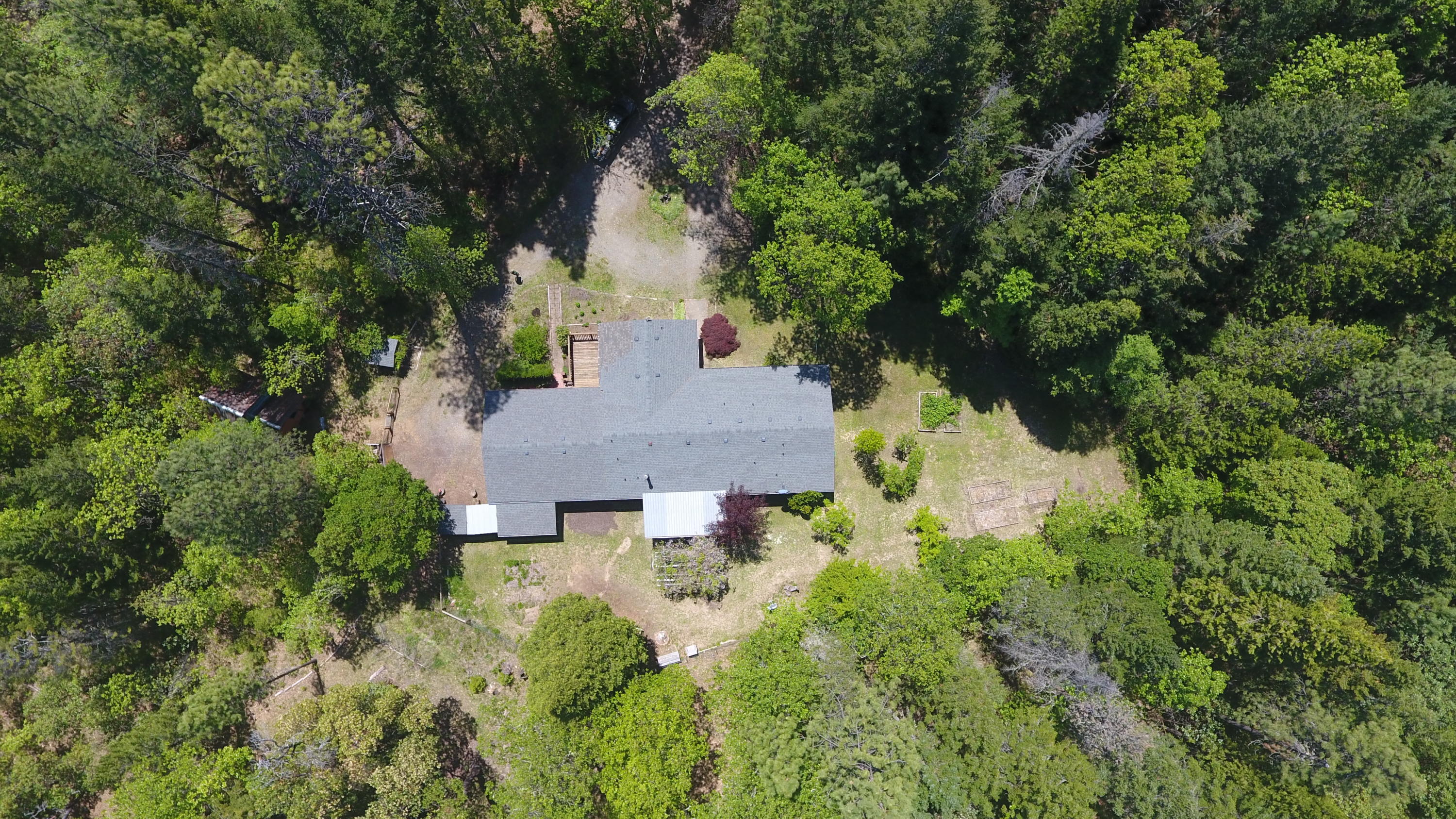 922 Garner Road Cave Junction, OR 97523 - Photo 8 of 24 an aerial view of a house with yard and outdoor seating