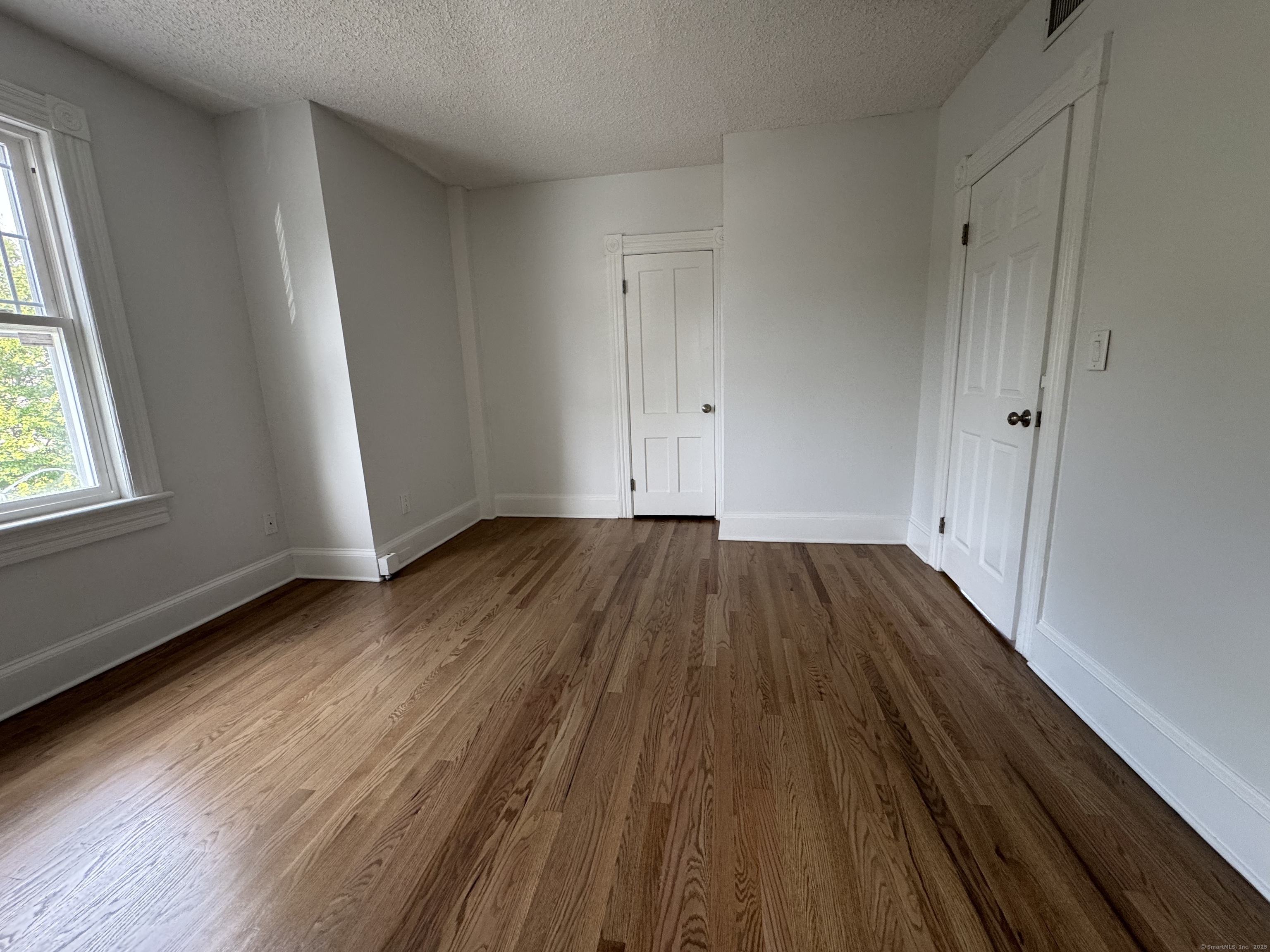 66 Church Lane Westport, CT 06880 - Photo 12 of 22 a view of a room with wooden floor and window