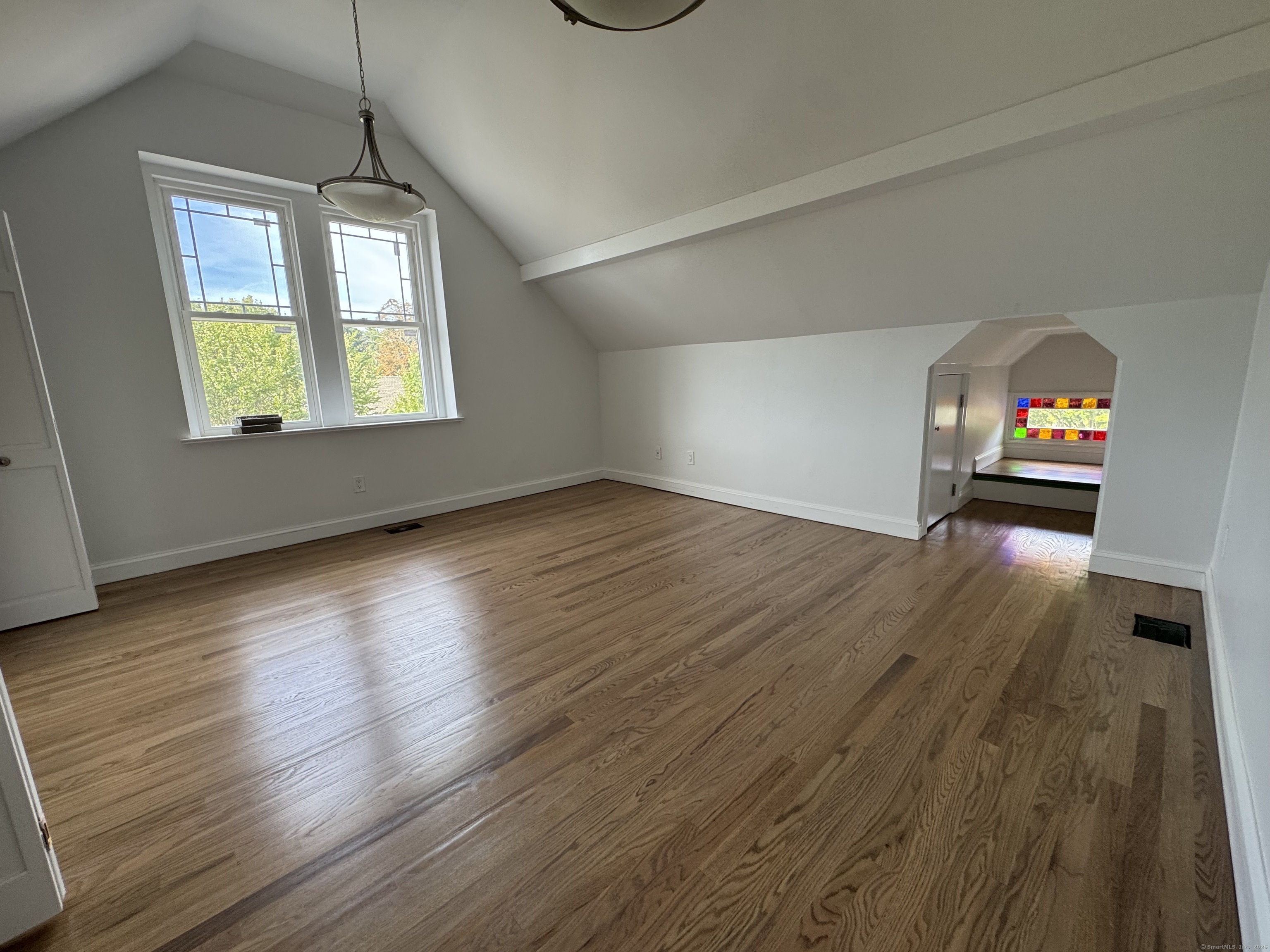66 Church Lane Westport, CT 06880 - Photo 13 of 22 an empty room with wooden floor and windows