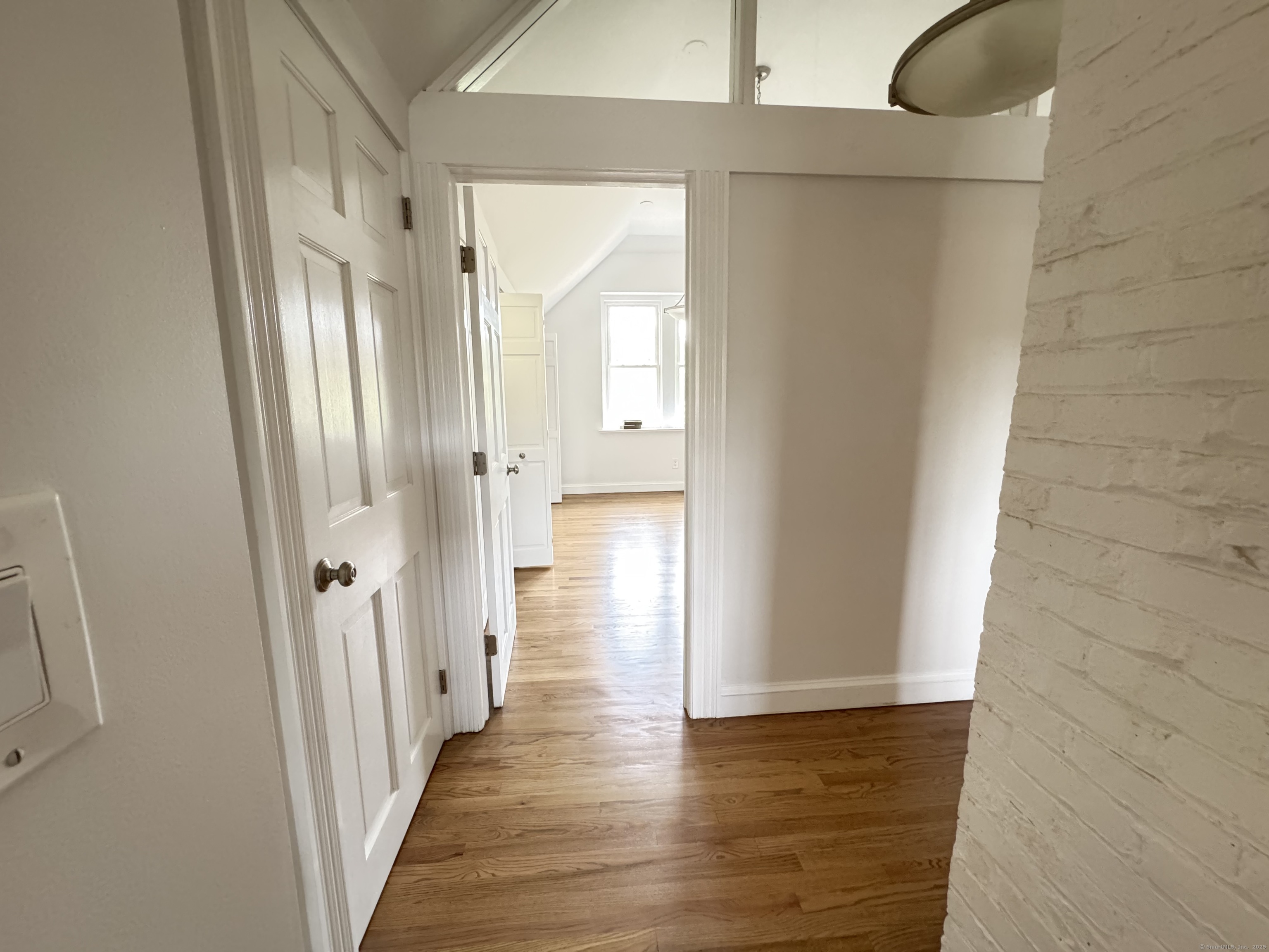 66 Church Lane Westport, CT 06880 - Photo 15 of 22 a view of a hallway with wooden floor
