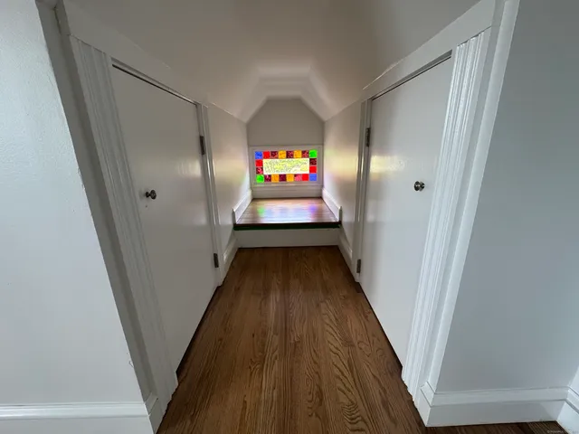 a view of a hallway view with staircase