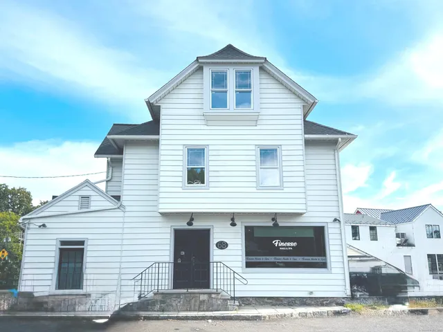 a front view of a house with garage