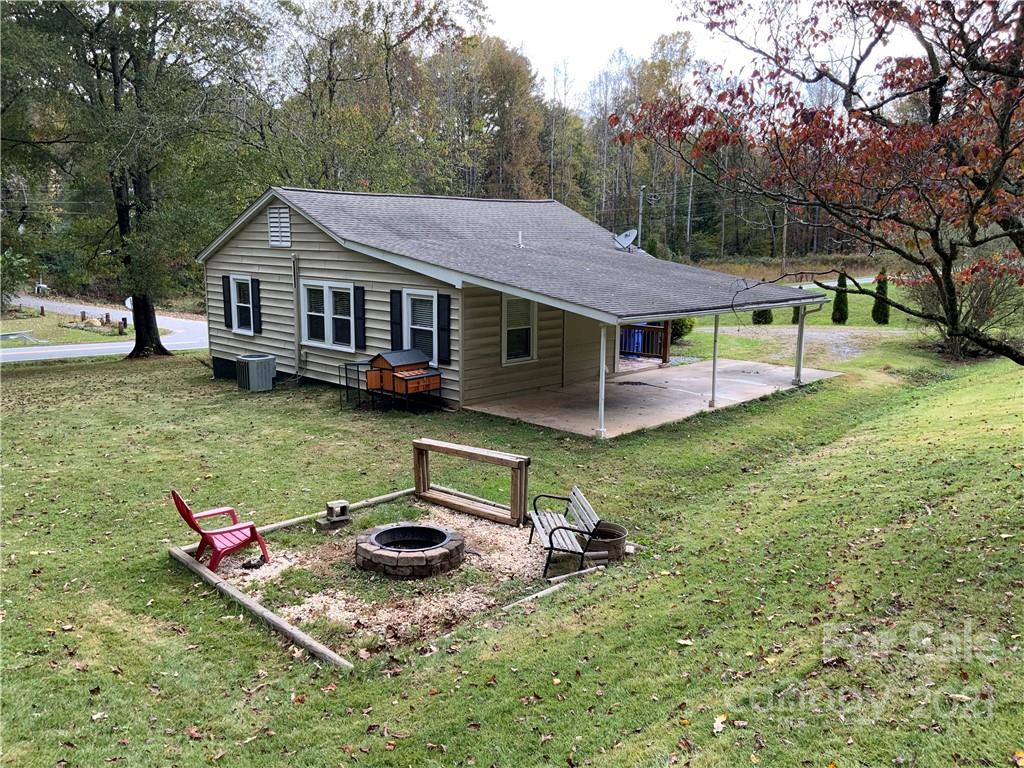317 Tryon Road Rutherfordton, NC 28139 - Photo 3 of 10 a aerial view of a house with swimming pool next to a yard