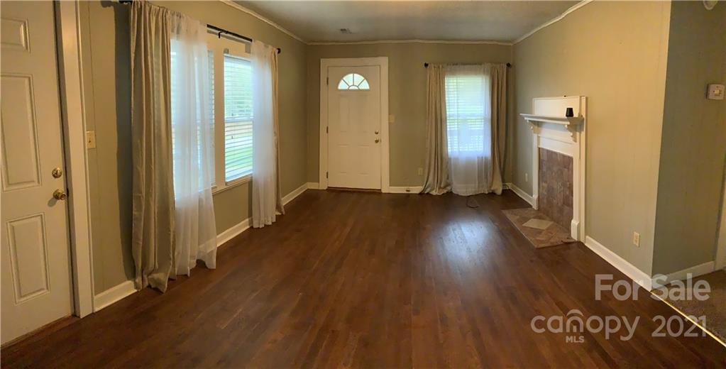 317 Tryon Road Rutherfordton, NC 28139 - Photo 5 of 10 a view of a hallway with wooden floor and stairs
